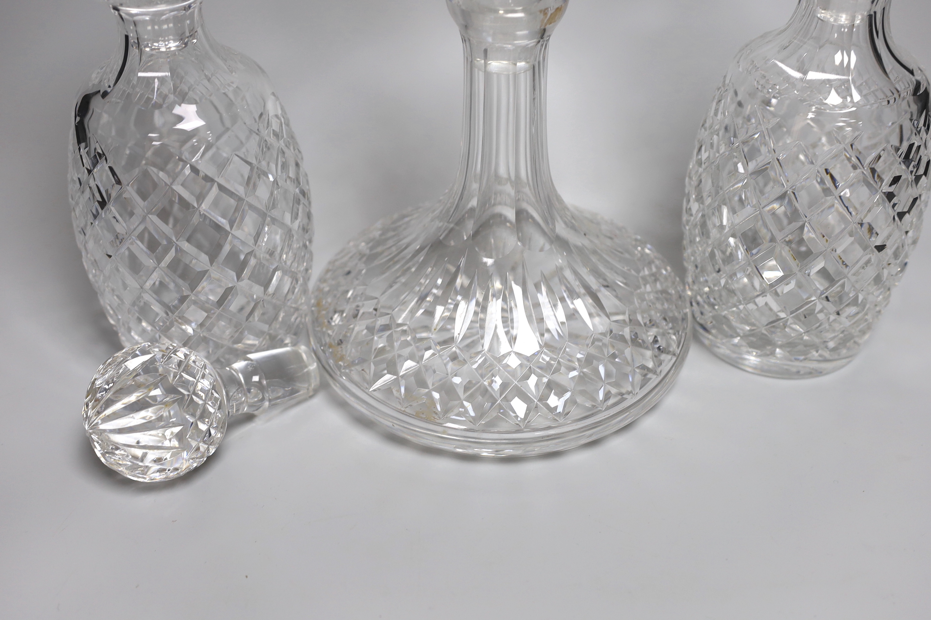 A pair of Waterford Colleen pattern decanters, a ships decanter a and four stoppers